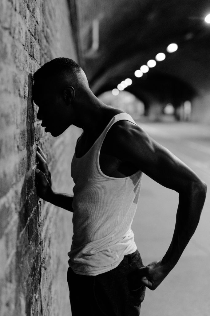 Guy punching wall portrait photography in London