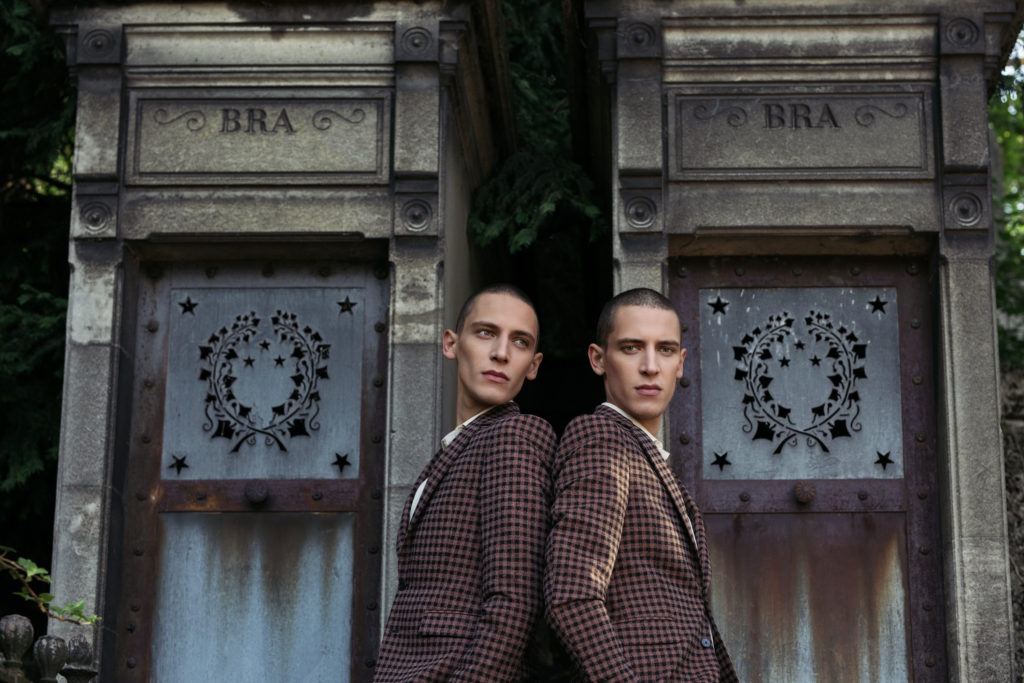 Twin brothers posing in Père Lachaise Cemetery