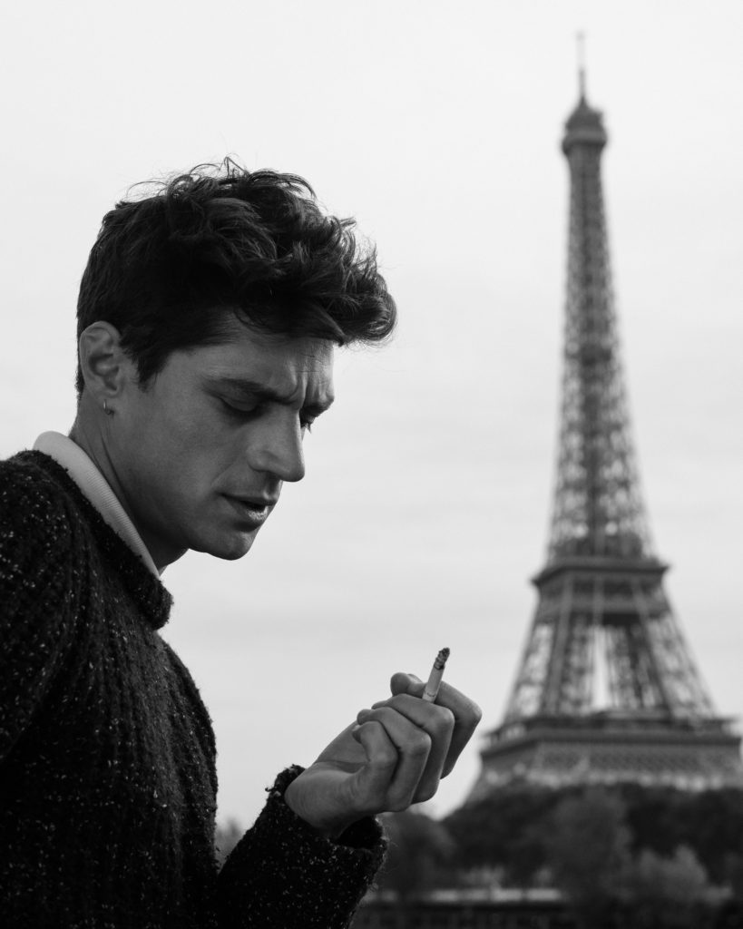 Men smoking by Eiffel tower